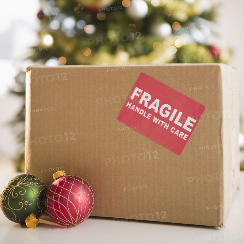 Christmas baubles beside fragile box. Photo : Jamie Grill Photography
