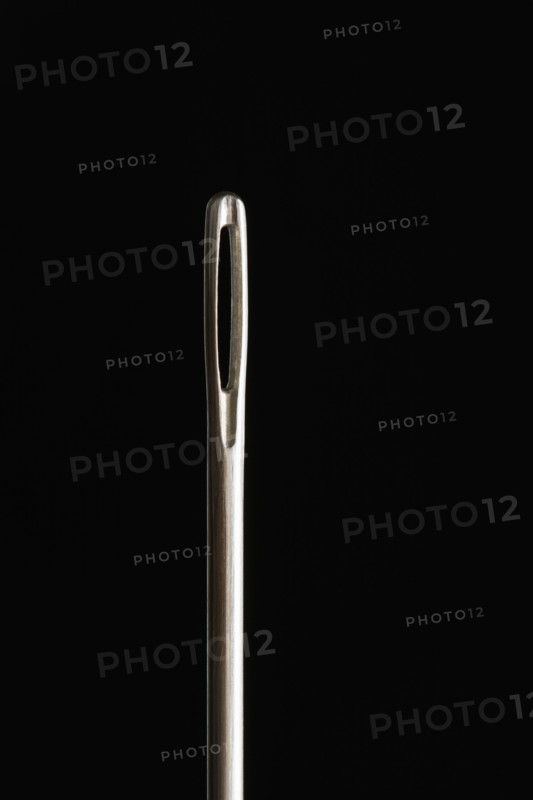 Close up of needle on black background. Photo : Kristin Lee