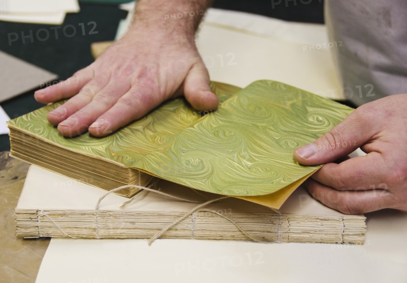 Hands binding book.
