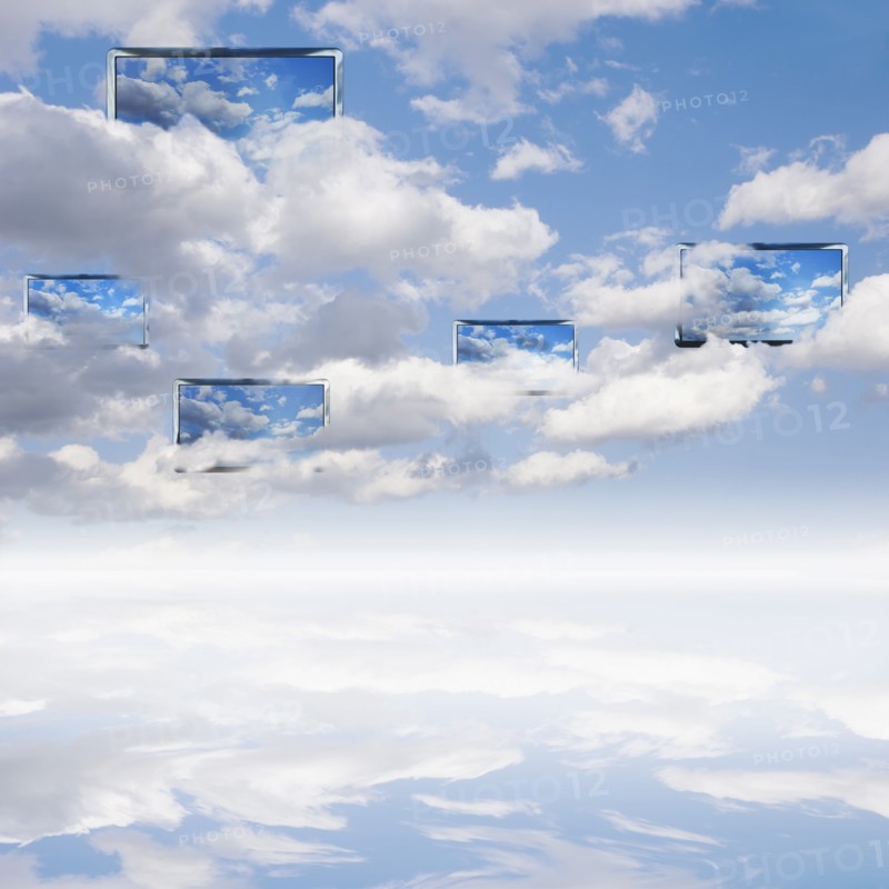 Digital composite with cloudscape and monitors.