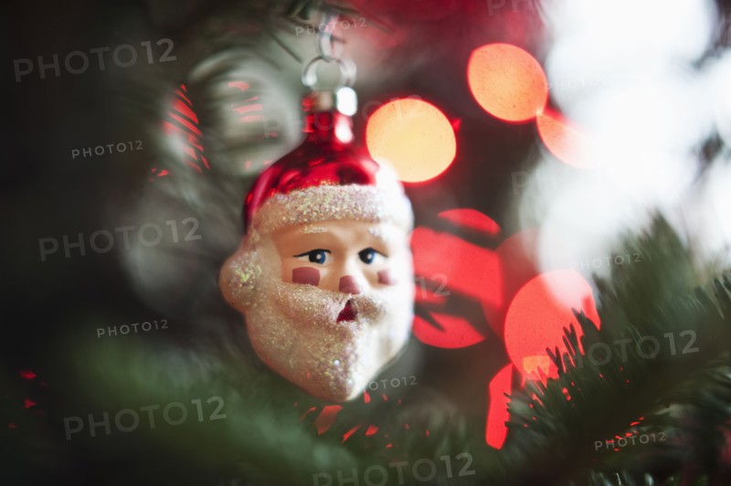 Santa Claus Christmas decoration hanging on Christmas tree, studio shot.