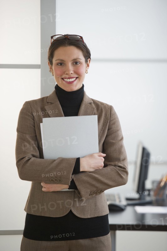 Portrait of young woman in office.