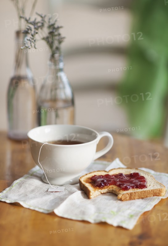 Cup of tea and toast with marmalade.