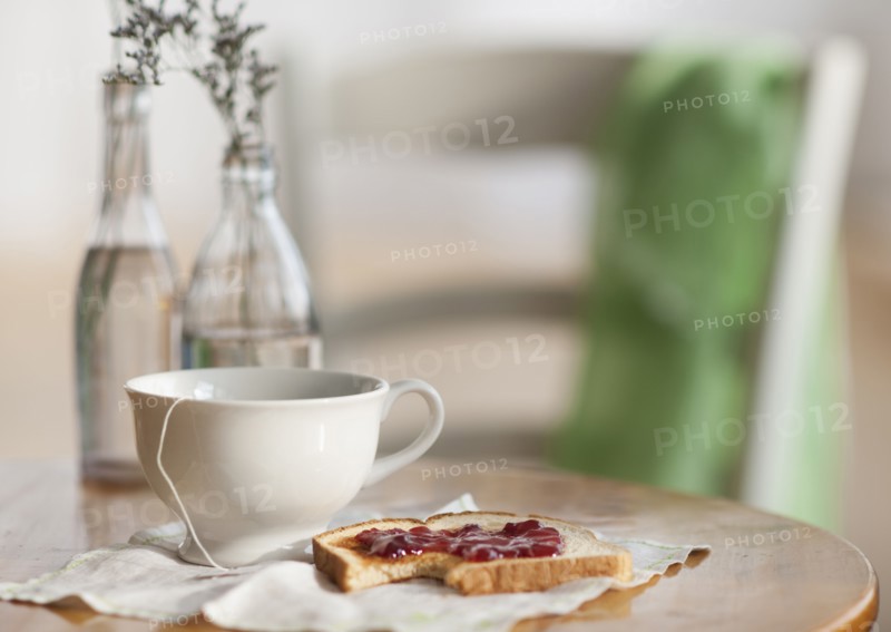 Cup of tea and toast with marmalade.