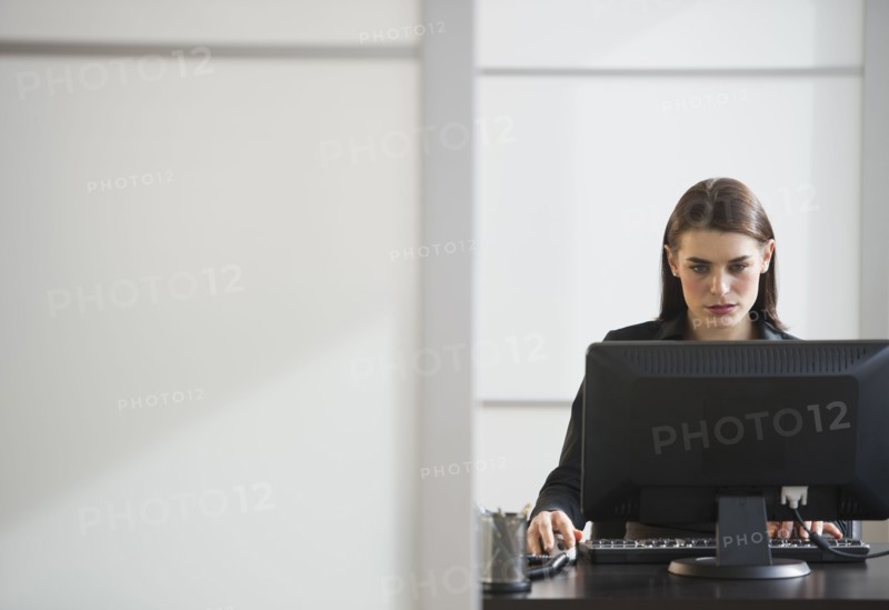 Businesswoman working in office.