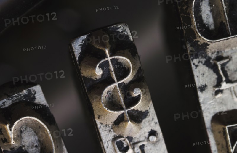 Close up of dollar sign on typewriter key.
