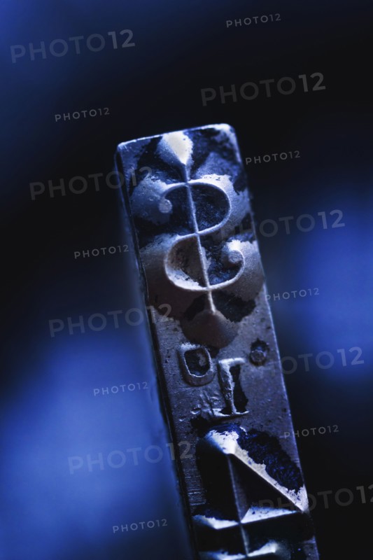 Close up of dollar sign on typewriter key.