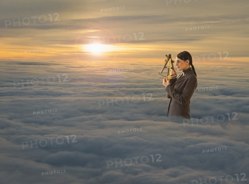 Women above clouds looking through sextant.
