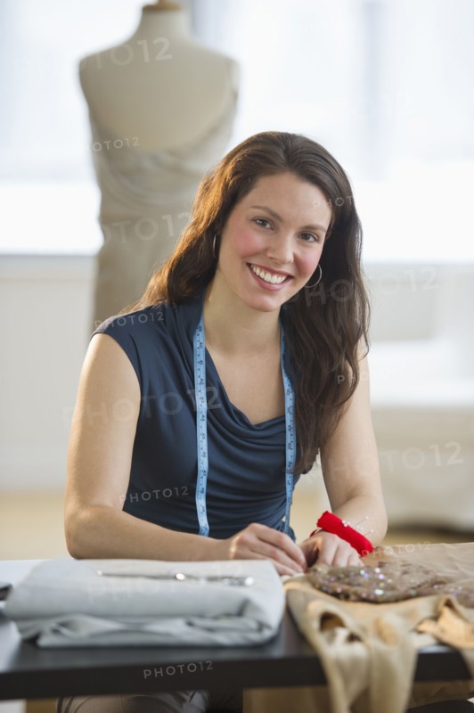 Portrait of young fashion designer at work.