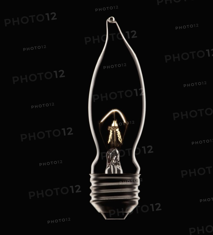 Energy saving bulb on black background, studio shot. Photo : Mike Kemp