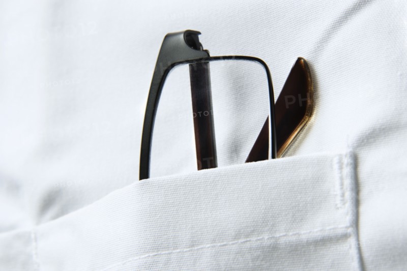 Glasses in pocket of doctors coat. Photo : Joe Clark
