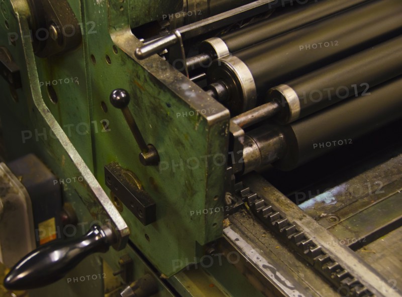 Close up of antique printing roller.