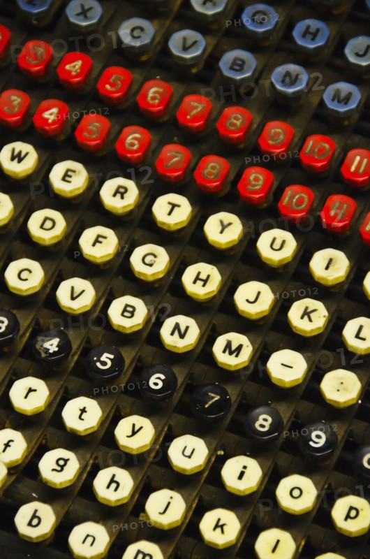 Close up of push buttons from printing press.