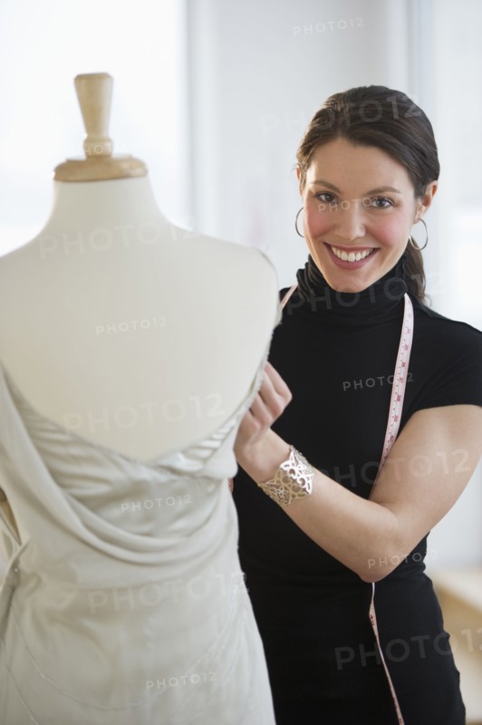 Portrait of young fashion designer at work.