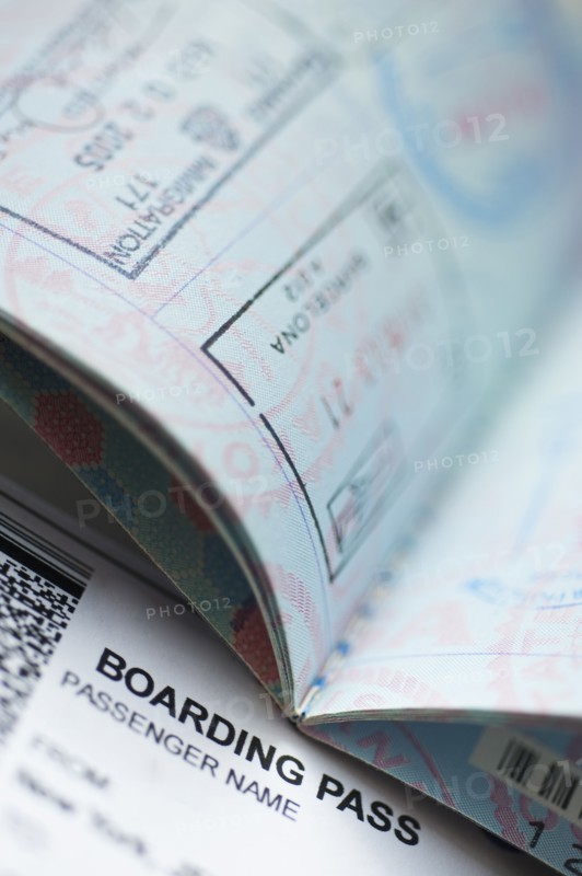 Passport with boarding pass inside.