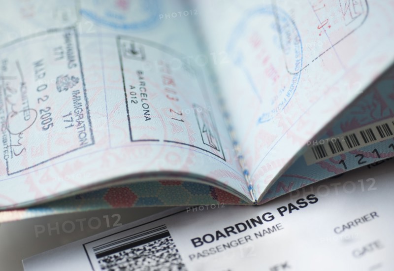 Passport with boarding pass inside.