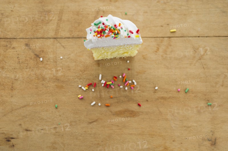 Homemade cupcake with missing bite.