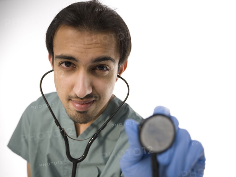 Young surgeon holding stethoscope. Photo : Dan Bannister