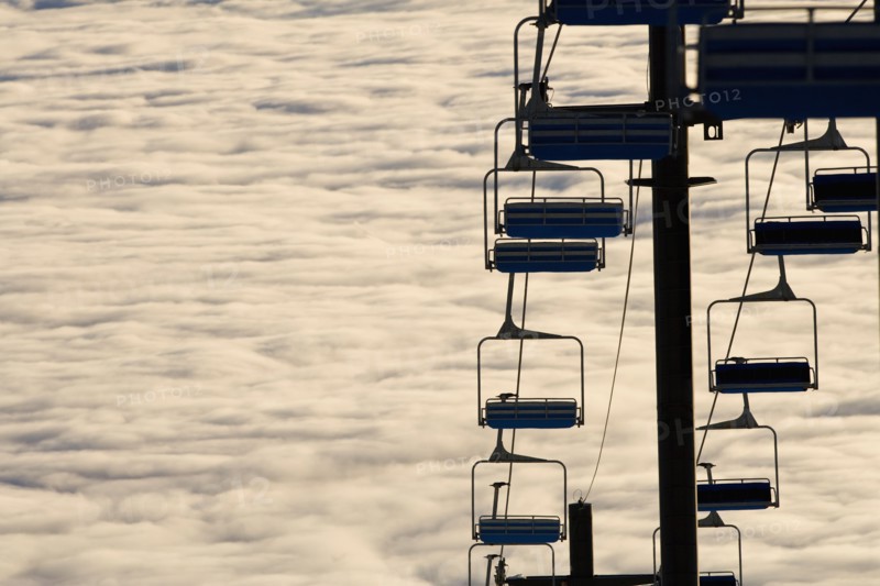 USA, Montana, Whitefish, Ski lift against clouds. Photo : Noah Clayton