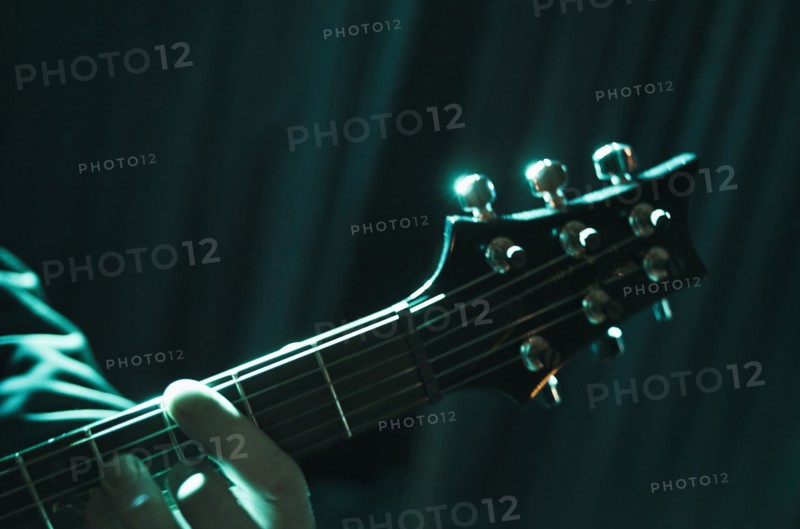 Hand playing guitar.