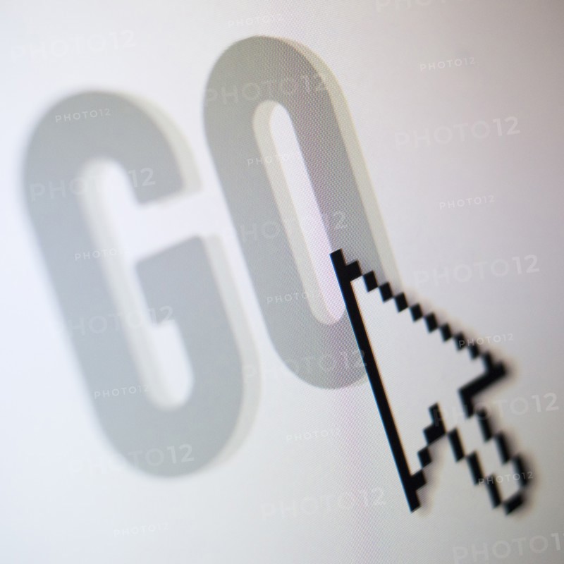 Studio shot of arrow cursor on go button. Photo: Jamie Grill Photography