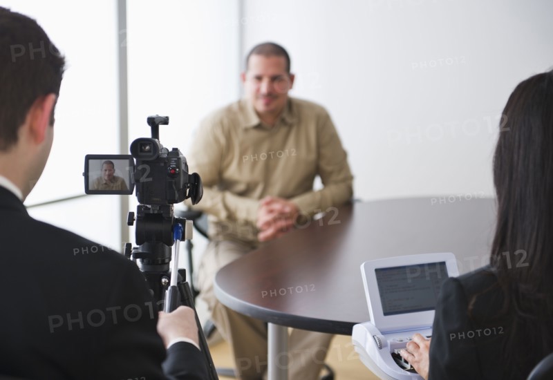 Testimony being videotaped. Photo: Daniel Grill