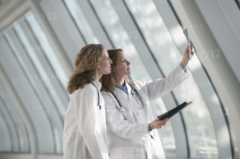 Two doctors examining x-ray. Photo: Mark Edward Atkinson
