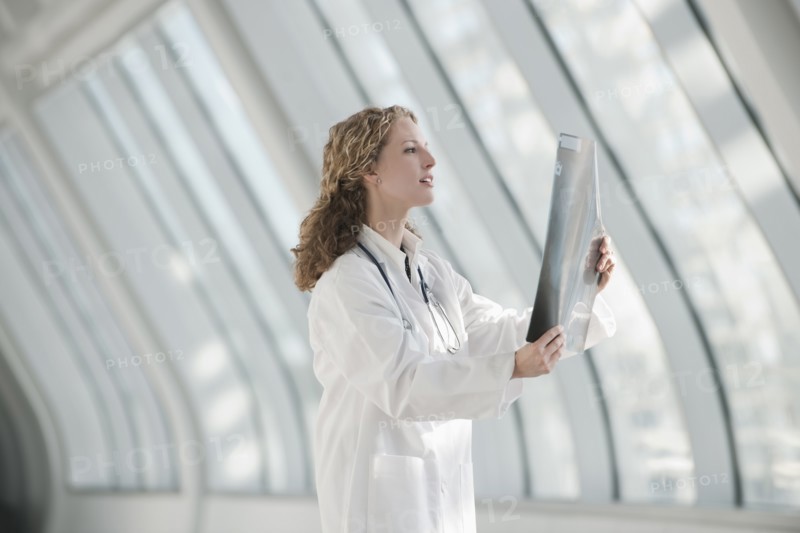 Doctor examining x-ray. Photo : Mark Edward Atkinson