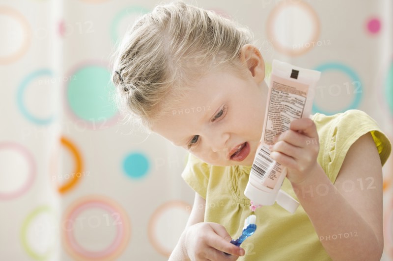 Girl (2-3) brushing teeth. Photo: Mike Kemp