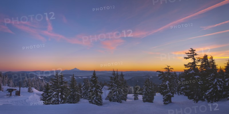 USA, Oregon, Snow covered field with Mount Jefferson in background, sunset. Photo: Gary Weathers