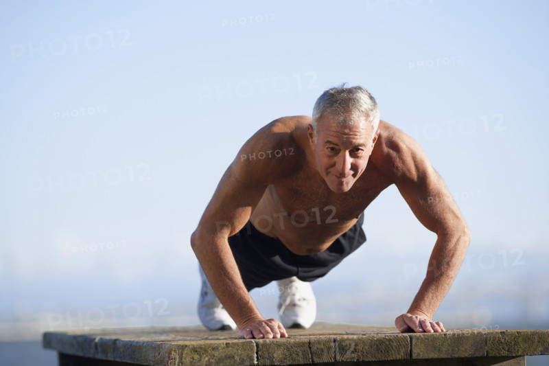 USA, California, Berkeley, Senior man exercising. Photo: Noah Clayton