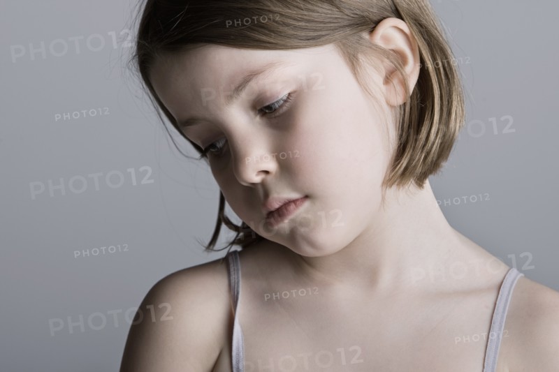 Studio portrait of sad girl (6-7). Photo: Justin Paget