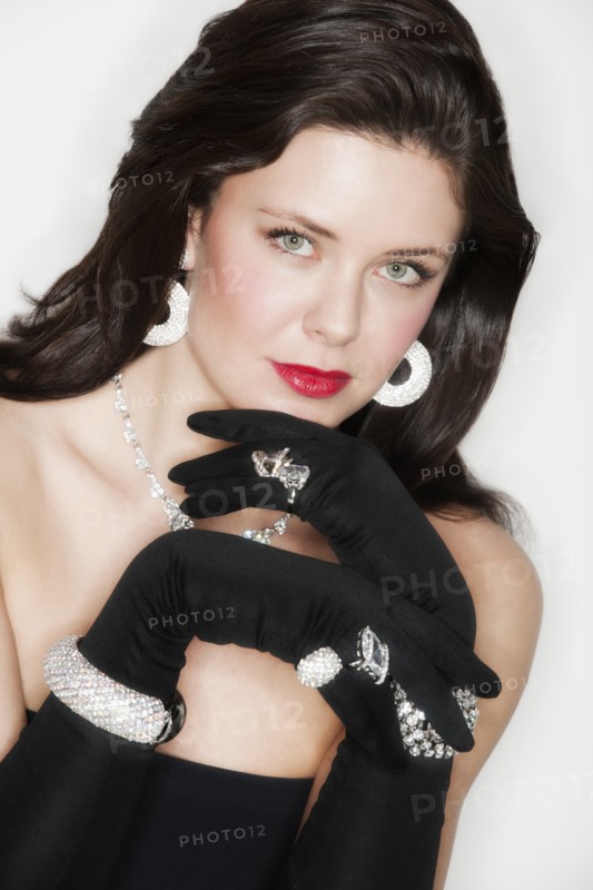 Portrait of young woman in evening wear.