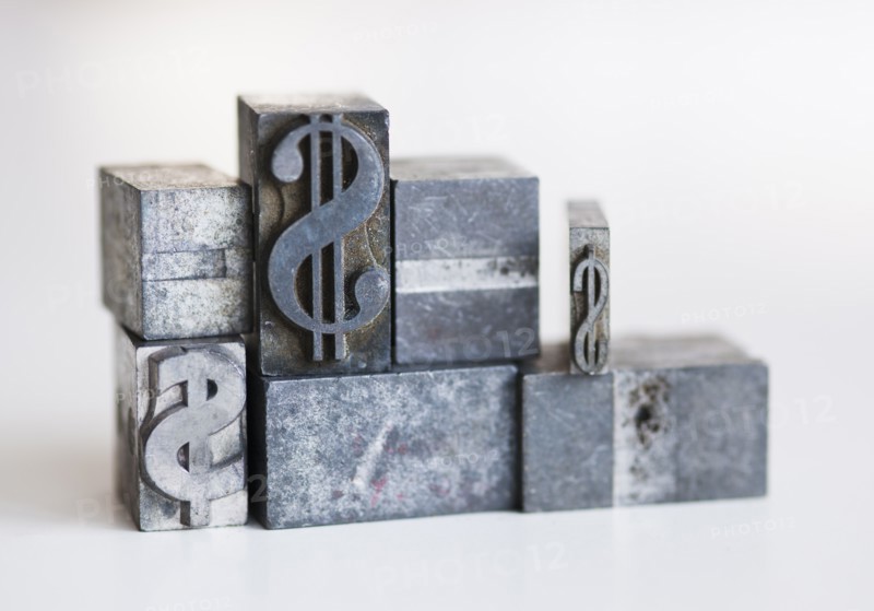 Close up of printing blocks with dollar sign.