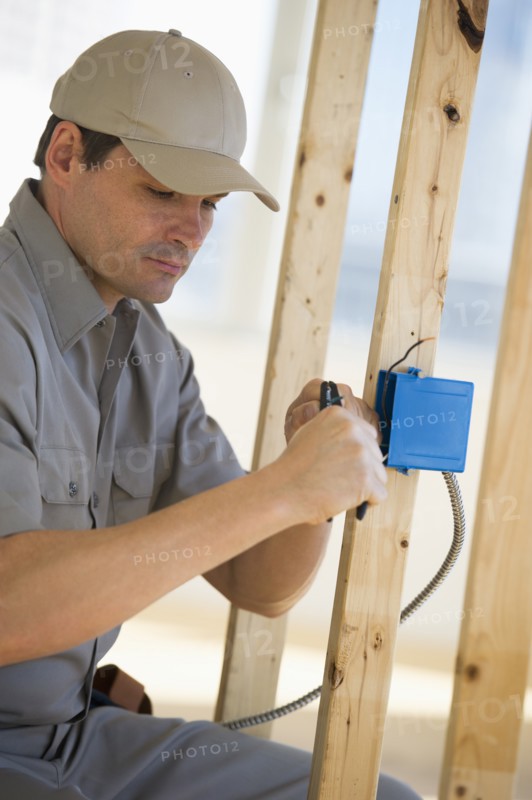 Electrician working at construction site.