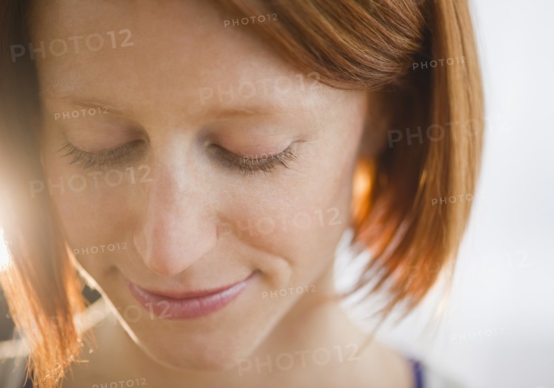Close-up of redhead woman. Photo: Jamie Grill Photography