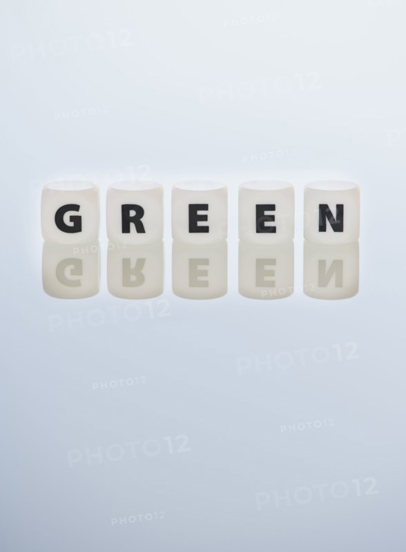 Studio shot of dice spelling out green. Photo: Daniel Grill