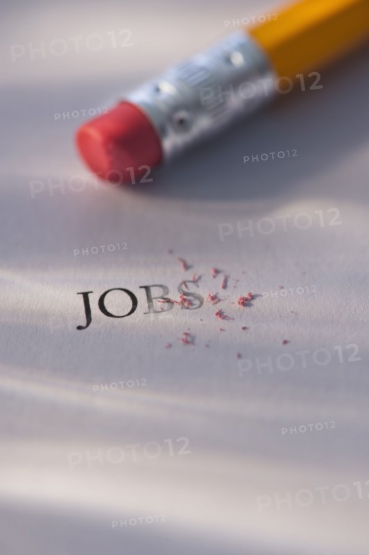 Studio shot of pencil erasing the word jobs from piece of paper. Photo: Daniel Grill