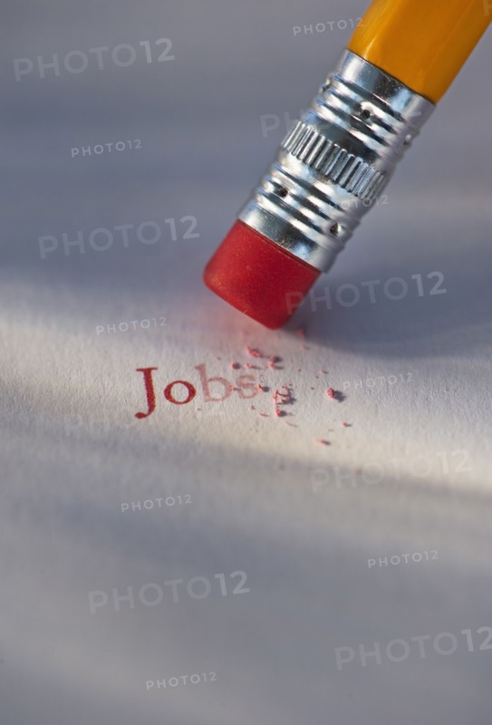 Studio shot of pencil erasing the word jobs from piece of paper. Photo: Daniel Grill