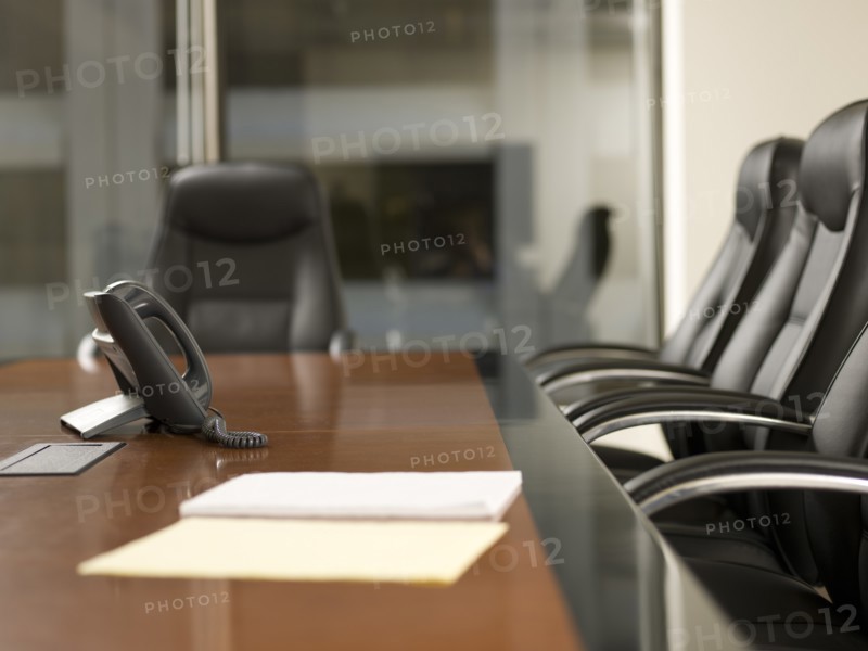 Paper and telephone in board room. Photo : Dan Bannister