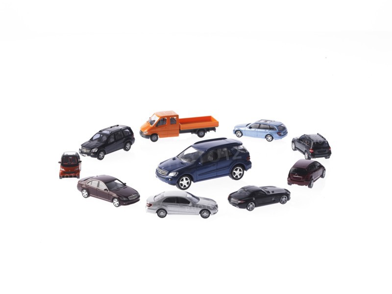 Circle of different cars on white background. Photo: David Arky