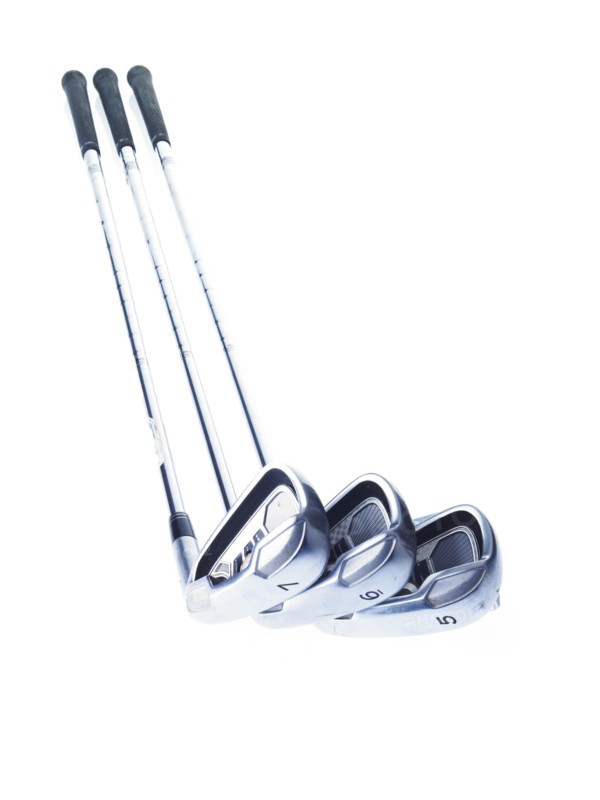 Three golf clubs on white background. Photo: David Arky