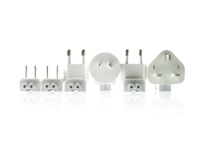 Row of plugs on white background. Photo : David Arky