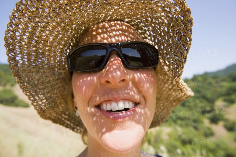 USA, California, Woman wearing straw hat. Photo : Noah Clayton