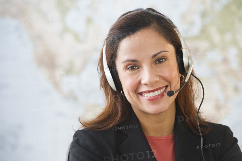 Smiling female customer service representative with headset.