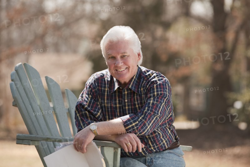 USA, Virginia, Richmond, portrait of senior man in adirondack chair. Photo: Mark Edward Atkinson
