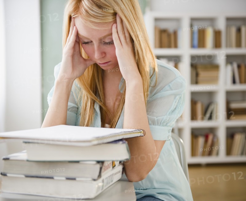Female student having headache. Photo : Jamie Grill Photography