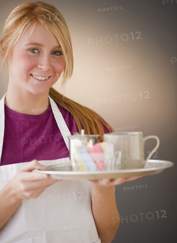 Waitress carrying tray with glass. Photo : Jamie Grill Photography