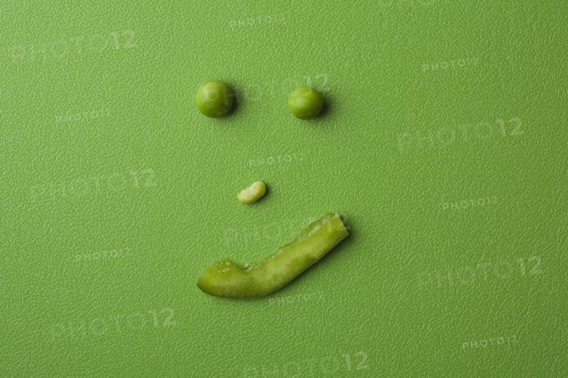 Anthropomorphic face made up from green peas. Photo: Kristin Lee