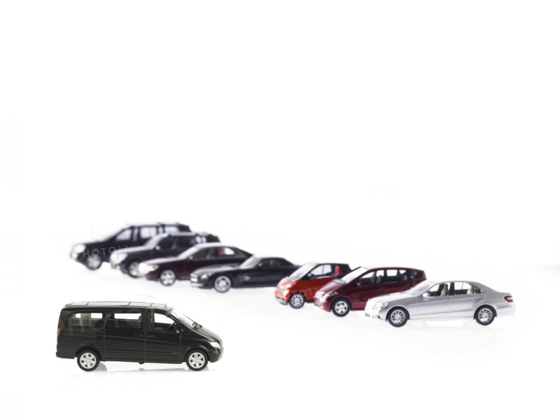 Row of different parked cars. Photo : David Arky